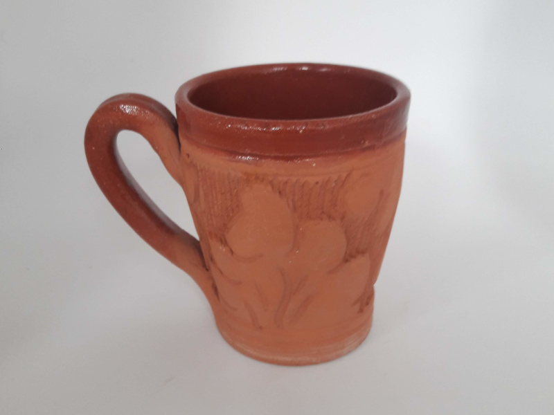 Tea Cup, half glaze with scupture.